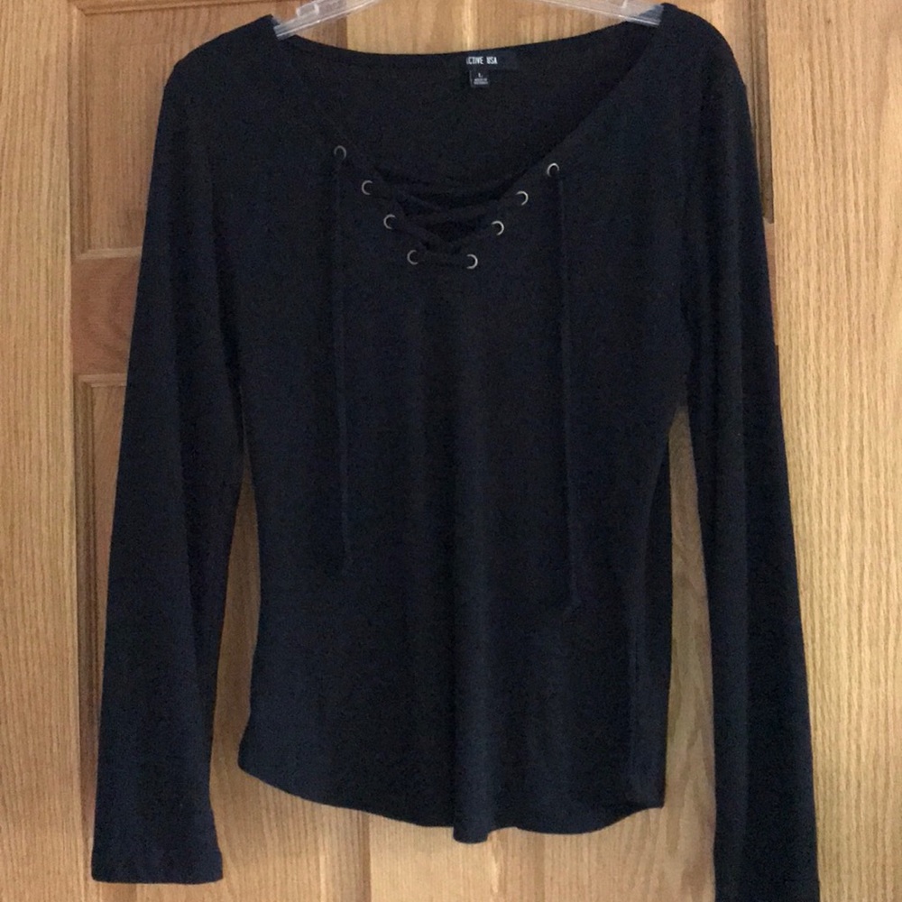Long sleeve lace up top. Runs small. Large.